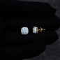 Side and front view of 9mm square moissanite cluster earrings with gold screw-back posts.