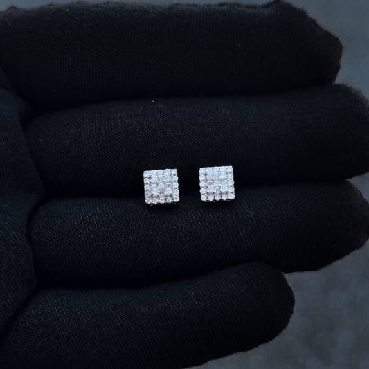 7mm sterling silver moissanite cluster earrings with 0.37ct diamonds shown on black glove.