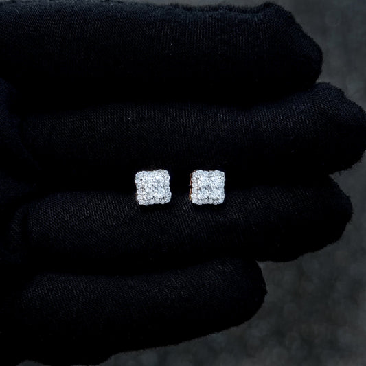 Sterling silver 7mm moissanite cluster stud earrings with sparkling cushion halo on glove.