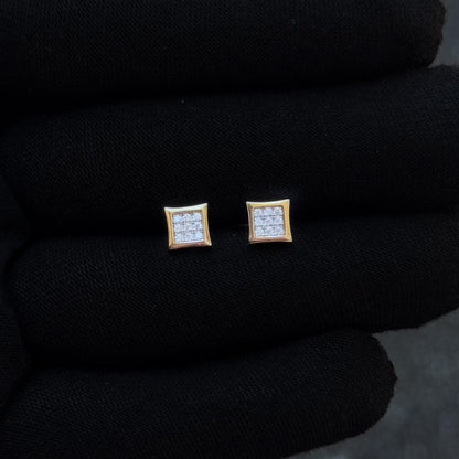 Gold-trim 6mm square moissanite cluster stud earrings displayed on black glove for detail view.