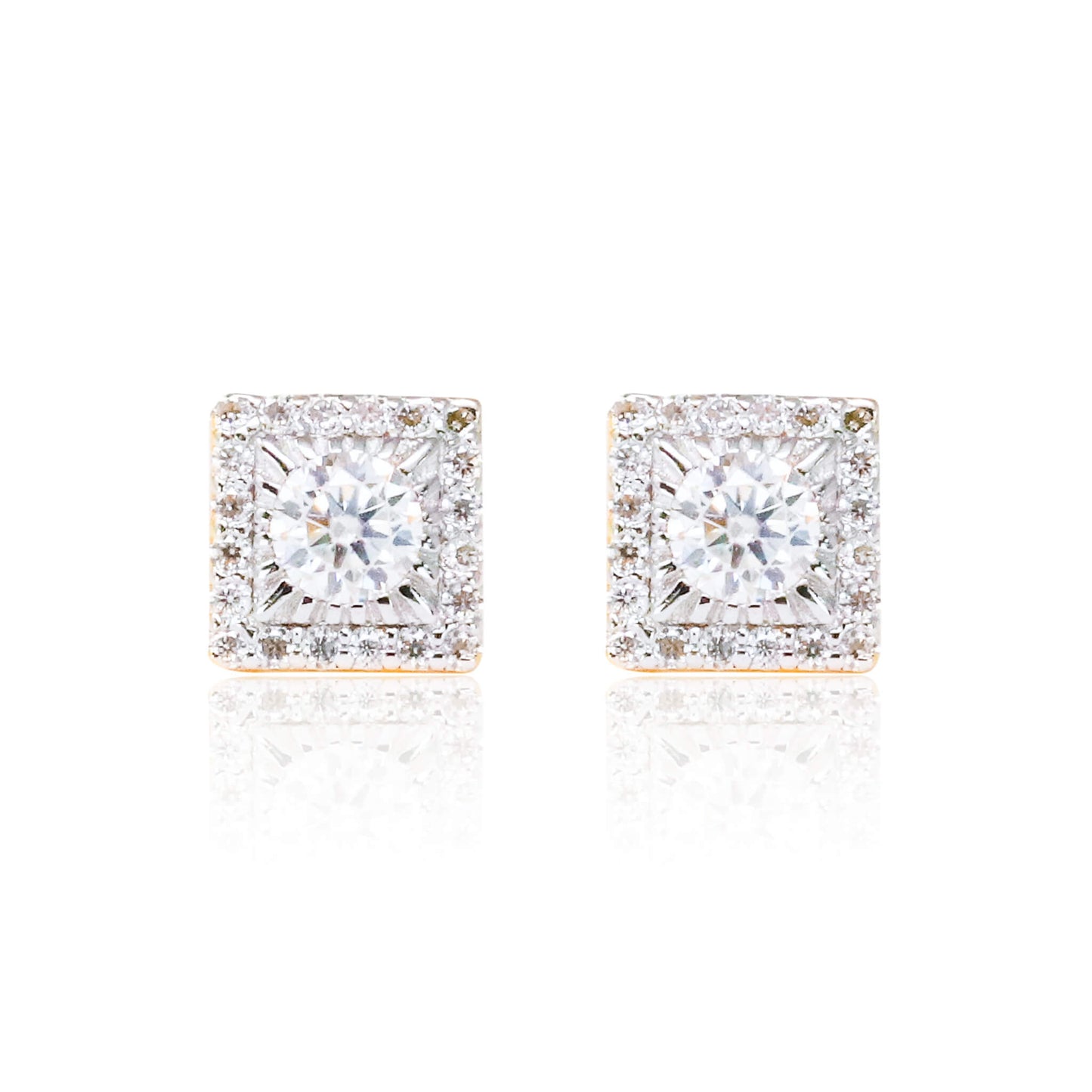 Close-up of sterling silver square moissanite cluster earrings with bright round center stones.