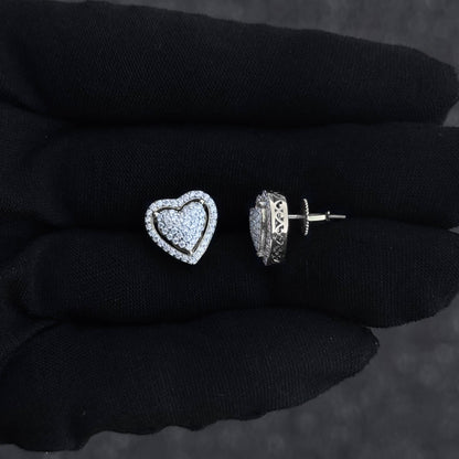 Close-up of heart moissanite cluster earring and screw-back post in sterling silver setting.