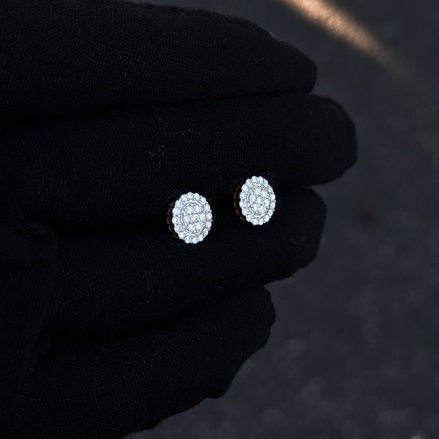 Gold-accent 8mm moissanite cluster stud earrings with sterling silver diamond halo detail.