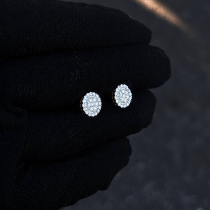 Gold-accent 8mm moissanite cluster stud earrings with sterling silver diamond halo detail.