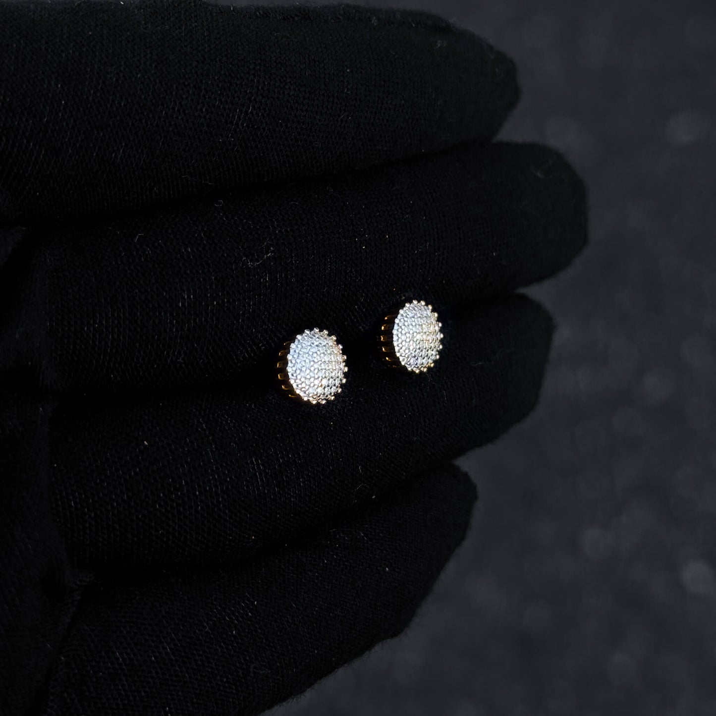 Gold-plated 8mm moissanite cluster stud earrings shown on display, sparkling diamond detail.
