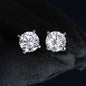 Pair of diamond stud earrings on a black background
