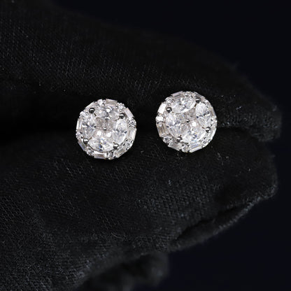 Pair of diamond stud earrings on a black background
