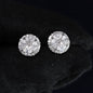 Pair of diamond stud earrings on a black background