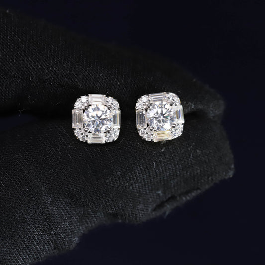 Pair of diamond stud earrings on a black background