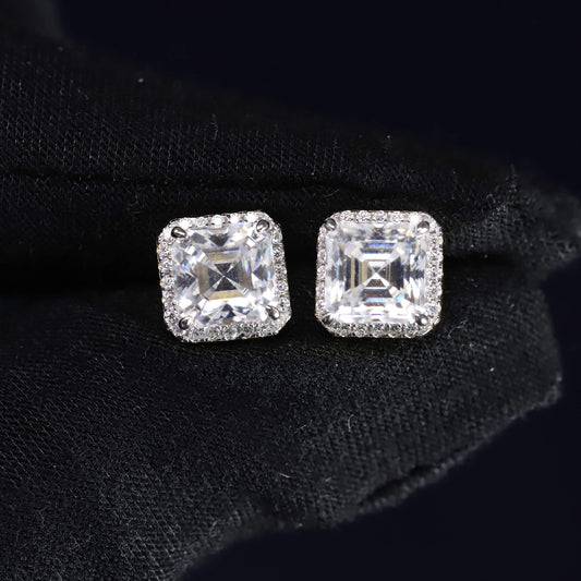 Square-cut diamond earrings on a black background