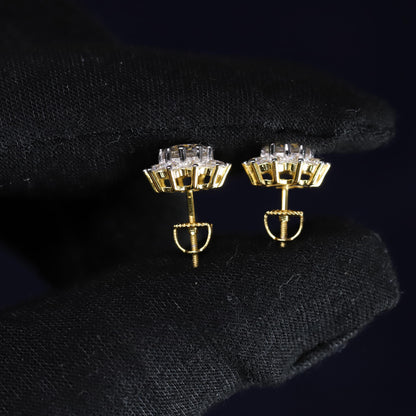 Gold and crystal earrings on a black background