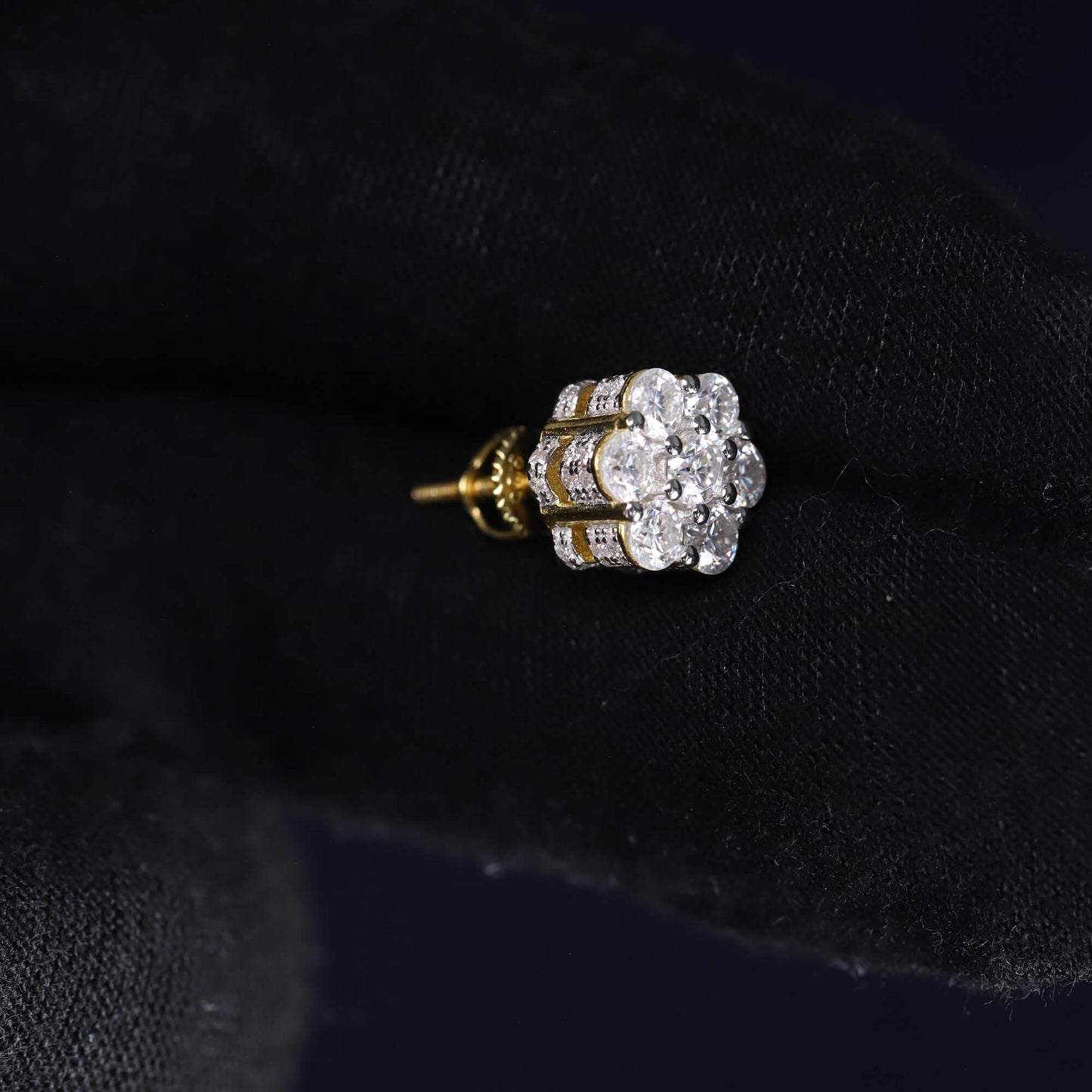 Diamond earring on a black velvet background