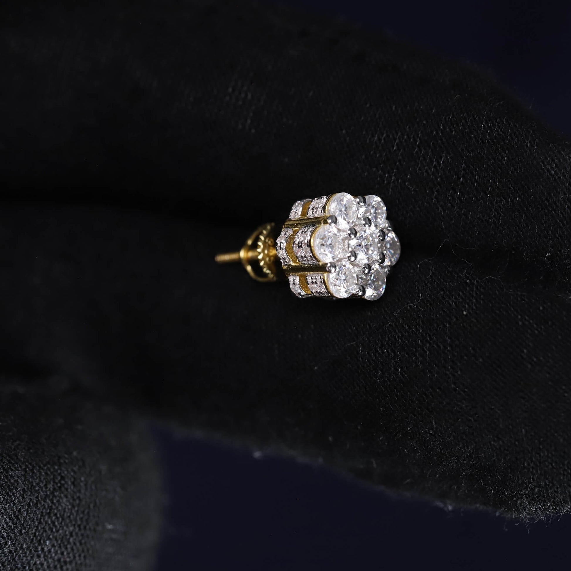 Diamond earring on a black velvet background