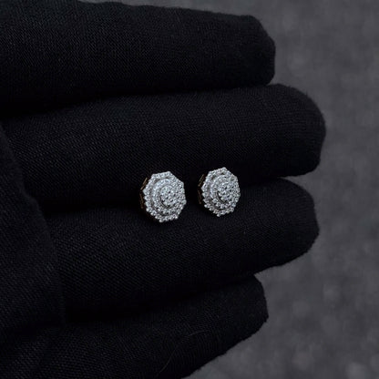 Moissanite octagon cluster diamond studs in sterling silver displayed on black glove.