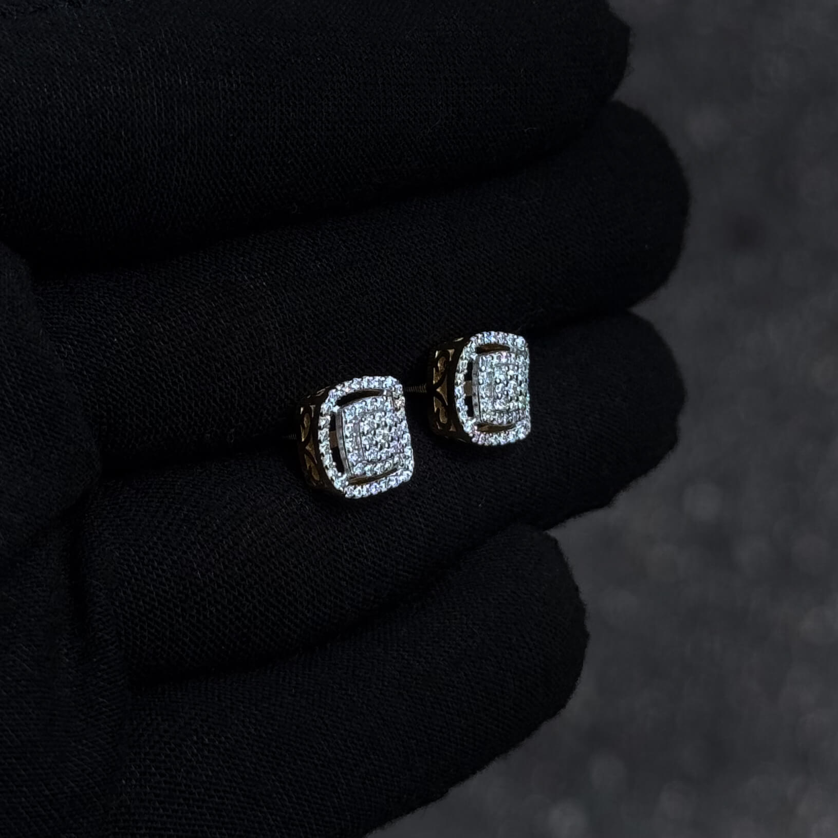 Side-angle view of square 10mm Moissanite cluster diamond stud earrings with gold-accented setting.