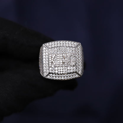 Silver ring with diamonds on a dark background