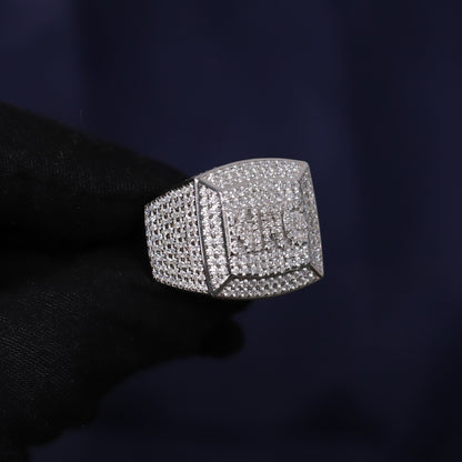 Silver ring with gemstones on a dark background