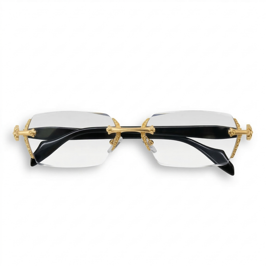 Sunglasses with gold frames and black lenses on a white background
