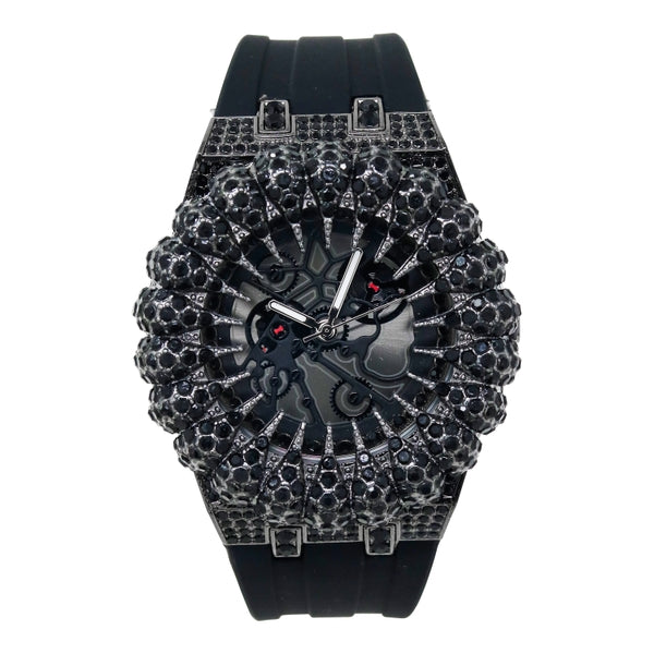 Black wristwatch with intricate design and gemstones on a white background