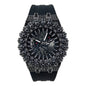 Black wristwatch with intricate design and gemstones on a white background
