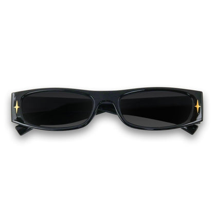 Black sunglasses with gold accents on a white background