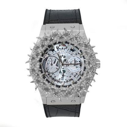 Luxury watch with a black leather strap and silver, diamond-studded face on a white background